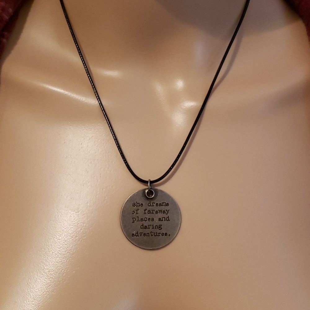 Antiqued faraway adventures message on black cord